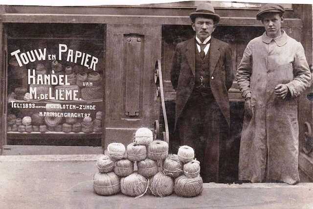 Meijer de Lieme standing before his business