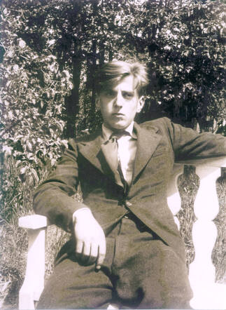 Vincent in white chair adj.jpg