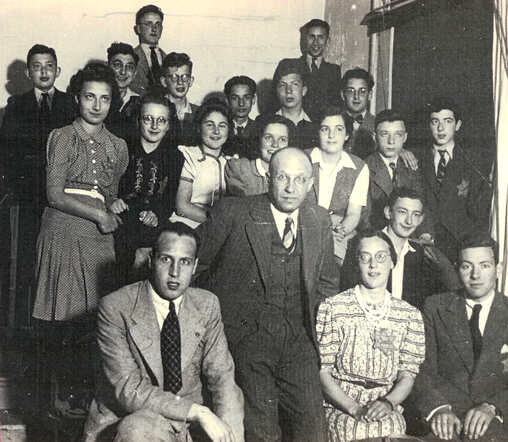 Michel Eduard Abrahams (right behind his teacher on the 1rst row) on s chool photo of the Jewish H.B.S.,  Mauritskade in Amsterdam, june 1942