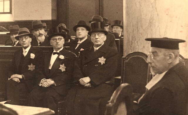 Hugo Mosbacher, Amsterdam, July, 1942 (he is on far right on bench and facing camera.) The event is the wedding of his niece. A month before this photo, all Jews in Amsterdam were required to wear the Yellow Star.
