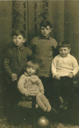 Gerrit Schellevis (front, right) and Machiel Schellevis (front, left) with their brothers (who survived the war)