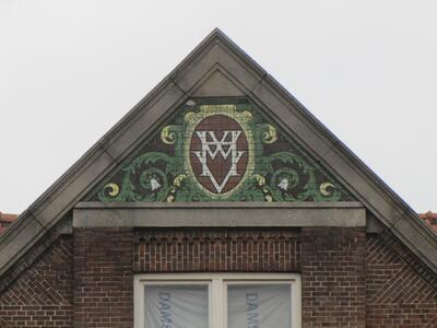 Logo van de Handwerkers Vriendenkring (bouwfonds).