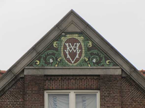 Logo van de Handwerkers Vriendenkring (bouwfonds).