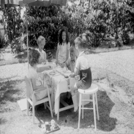 Elly Rosalie Birnbaum (dark haired girl in the photo)with chilren from the neighbourhood, 1941