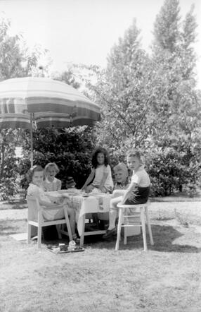 Elly Rosalie Birnbaum (dark haired girl in the photo)with chilren from the neighbourhood, 1941