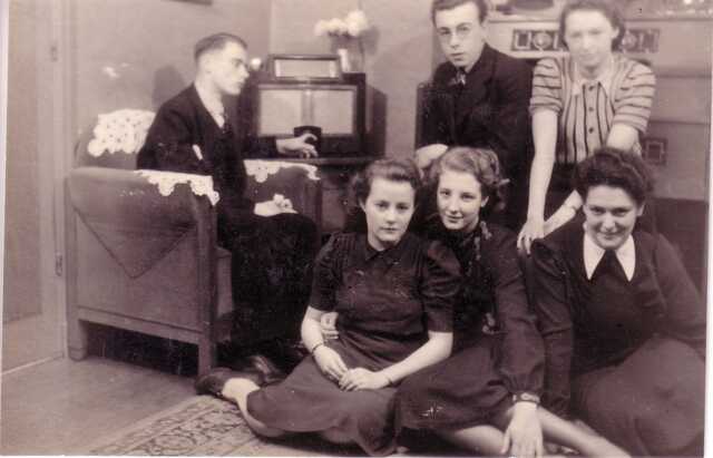 Clara de Boers (sitting on the floor, far right) with friends