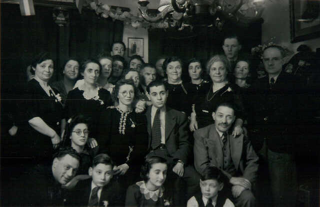 Hendrika (Hennie) de Boers (bottom row, 3rd from the left, with her eyes closed),at the wedding of her elder brother Jaap (middle), who survived the war. The others are unknown.