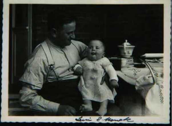 Magdalena (Leni) Valk, 8 months old, with her father