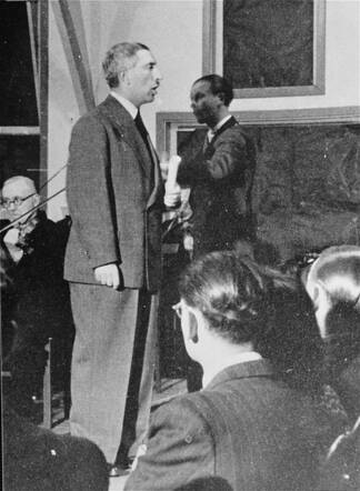 A musical performance by Mr. Rokach in the main hall of the Westerbork transit camp during a religious holiday - #45379.jpg