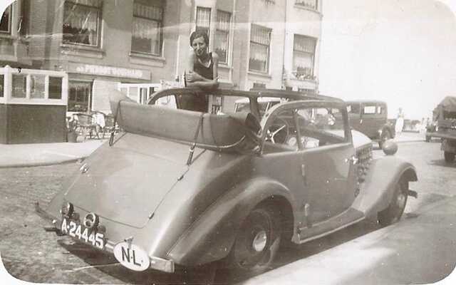 Hennie Kan-Vles, posing in her husband's car.